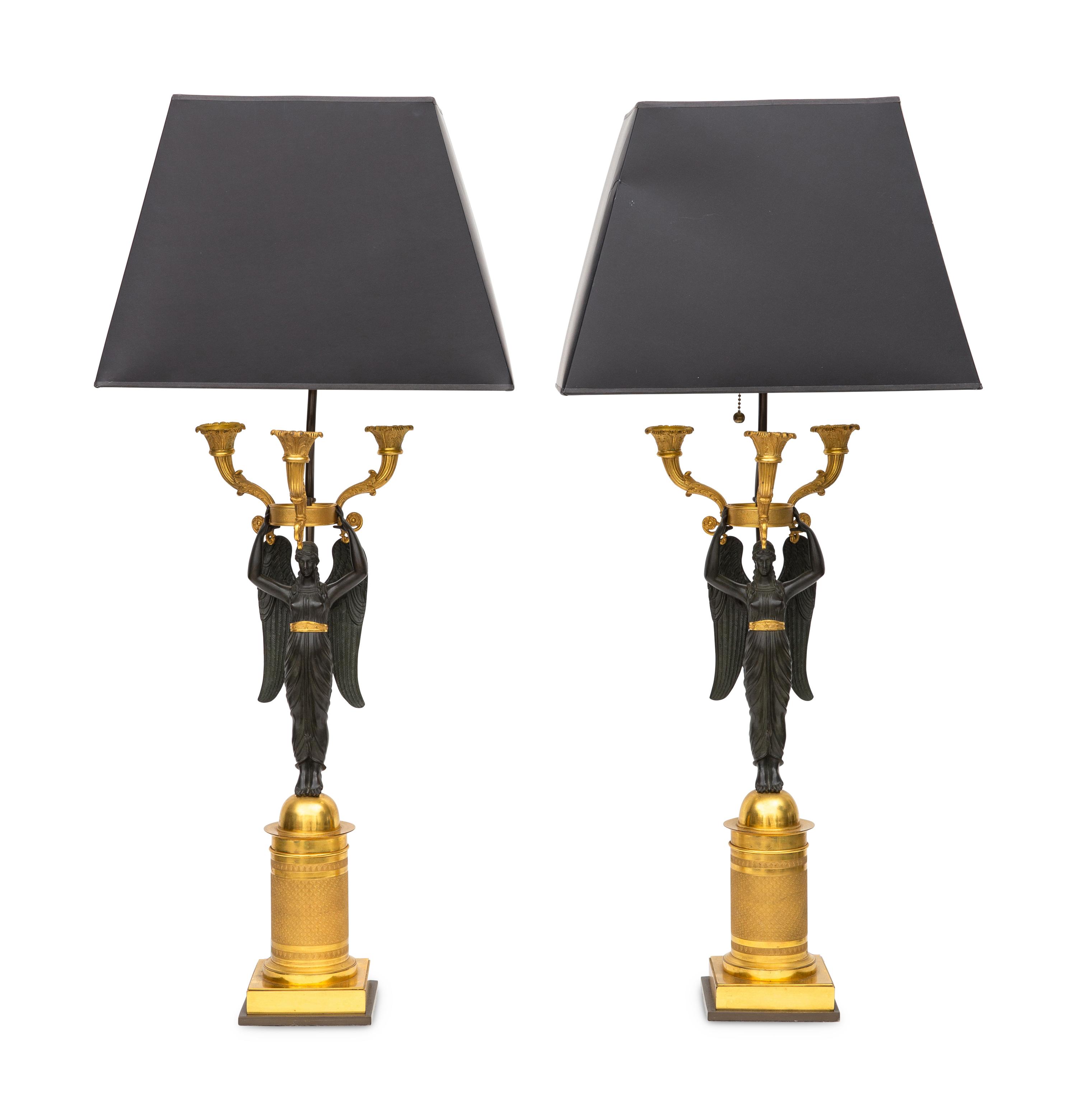 A Pair of Empire Style Gilt and Patinated Bronze Two-Light Figural Candelabra