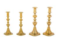 Four English Diamond Pattern Brass Candlesticks