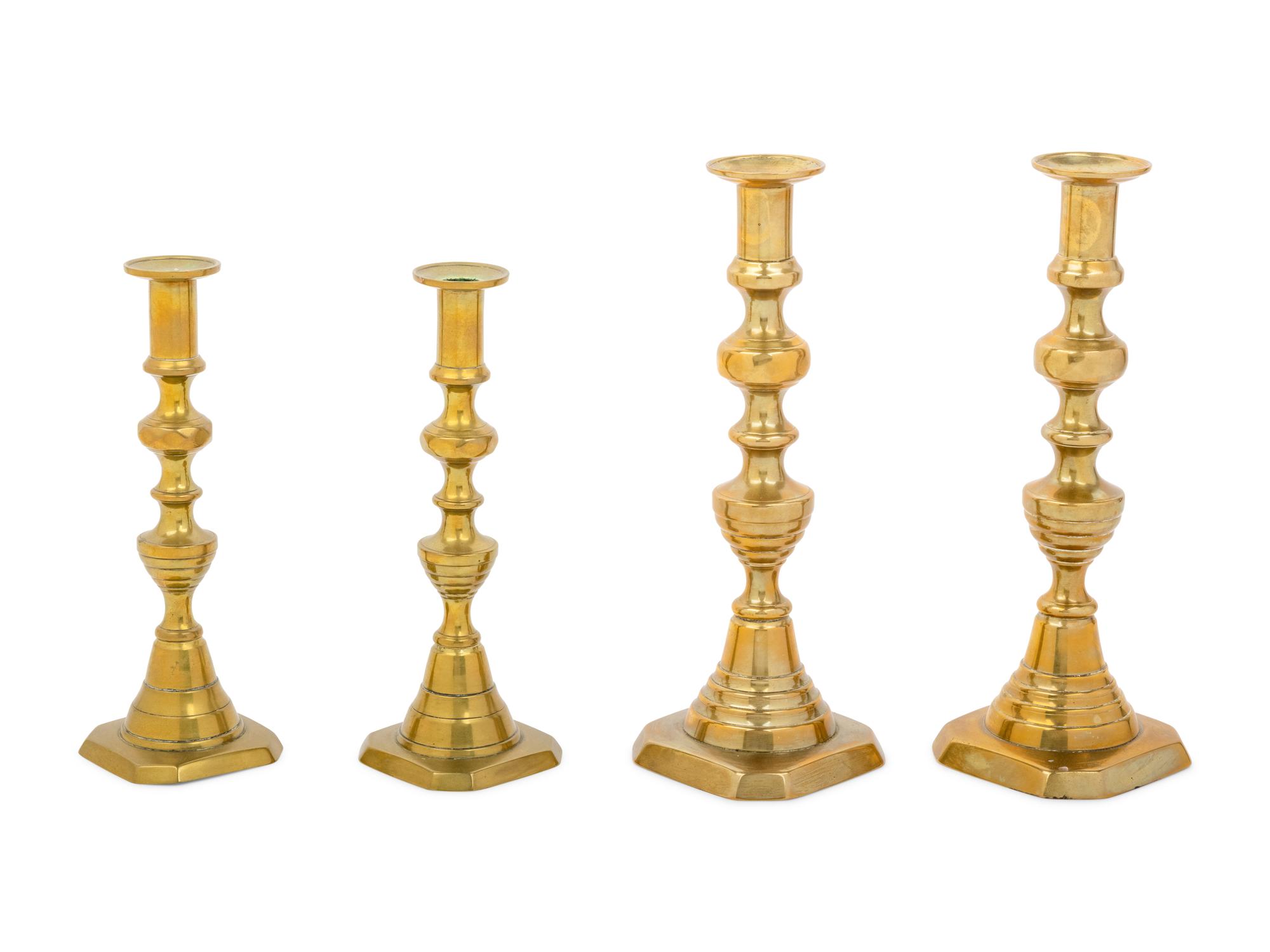 Four English Diamond Pattern Brass Candlesticks