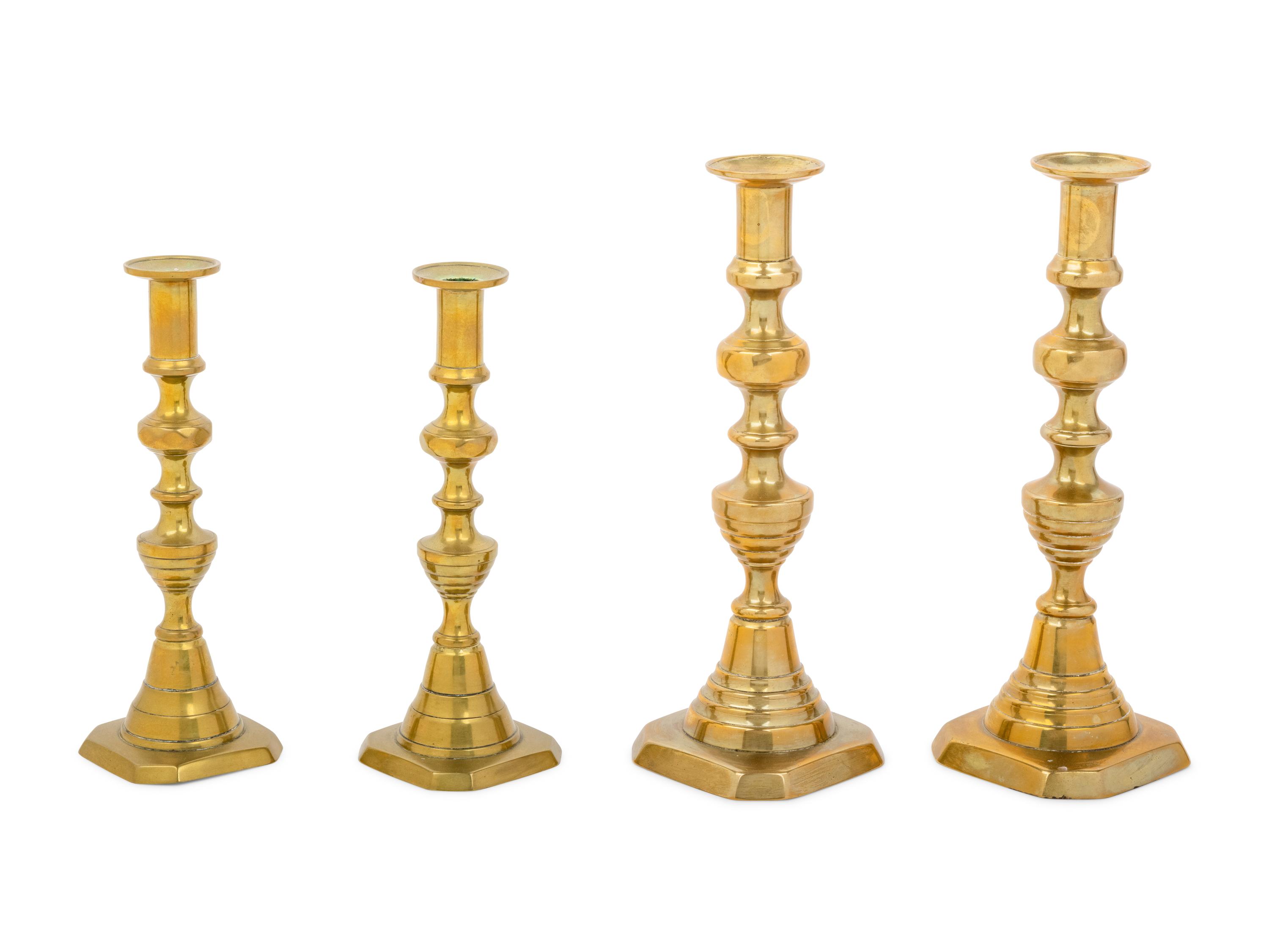 Four English Diamond Pattern Brass Candlesticks