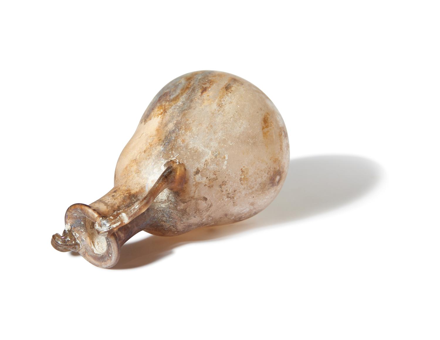 A Roman Pale Yellow Glass Bottle