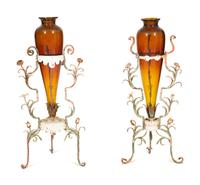A Pair of Polychrome Painted Metal Stands with Amber Glass Amphora Vases