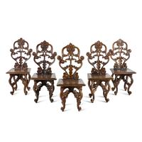 A Set of Five German Carved Walnut Side Chairs