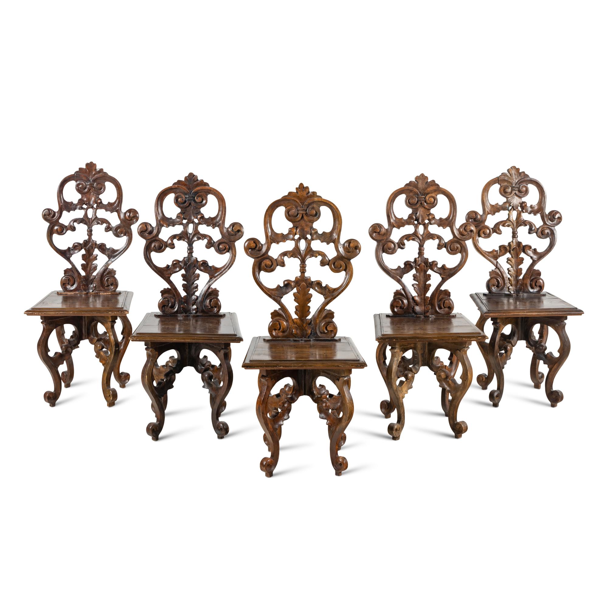 A Set of Five German Carved Walnut Side Chairs
