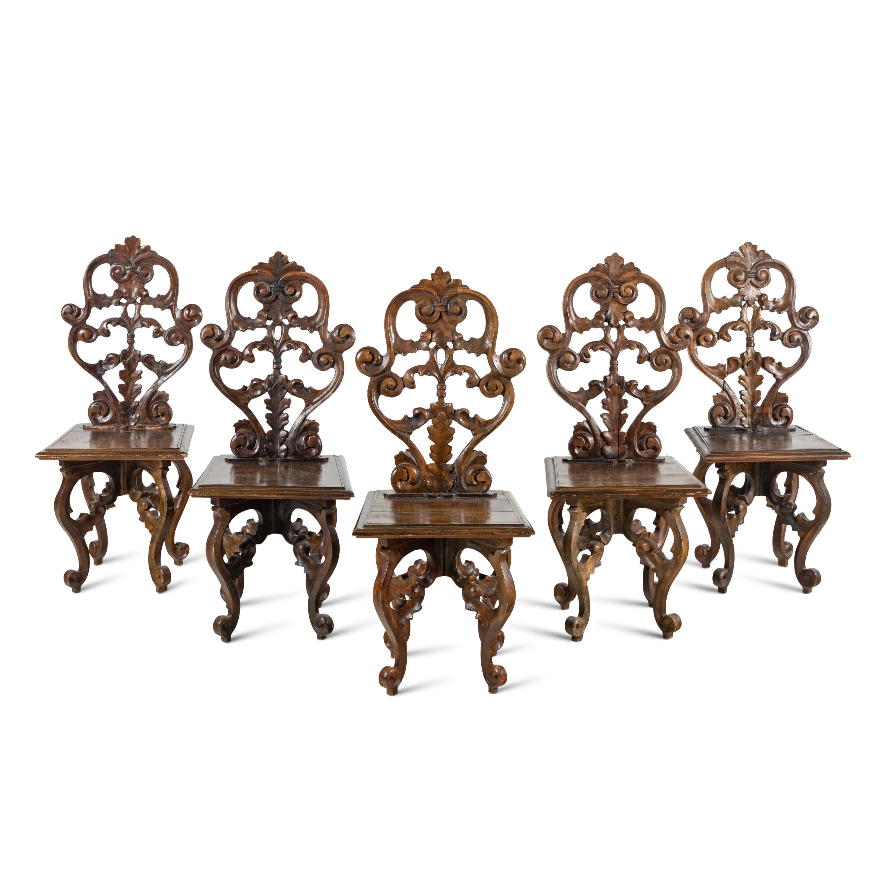 A Set of Five German Carved Walnut Side Chairs