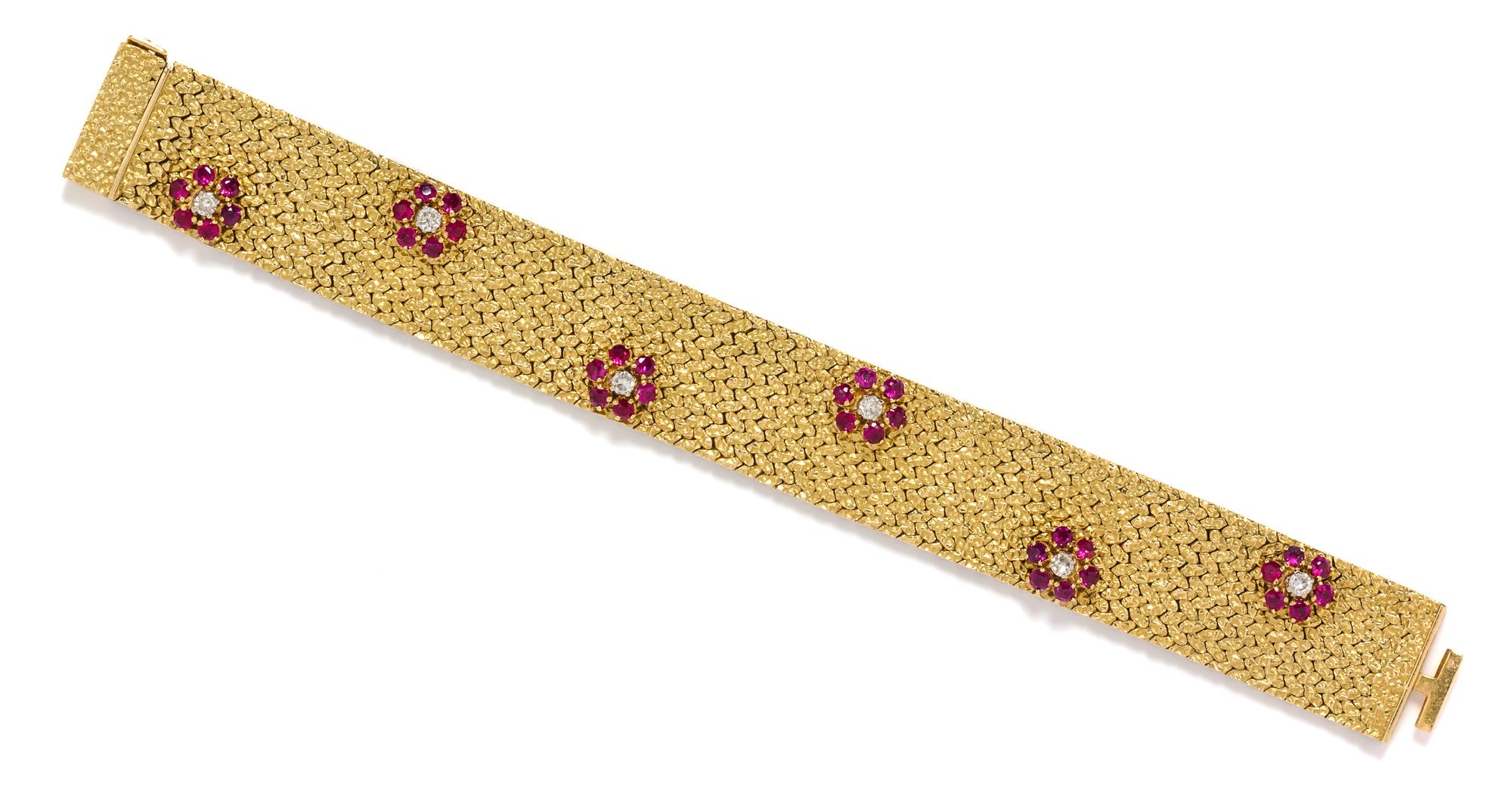 An 18 Karat Yellow Gold, Ruby and Diamond Bracelet, British, Circa 1969, 46.80 dwts.