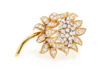 A Vintage 18 Karat Gold and Diamond Flower Brooch, 16.30 dwts.