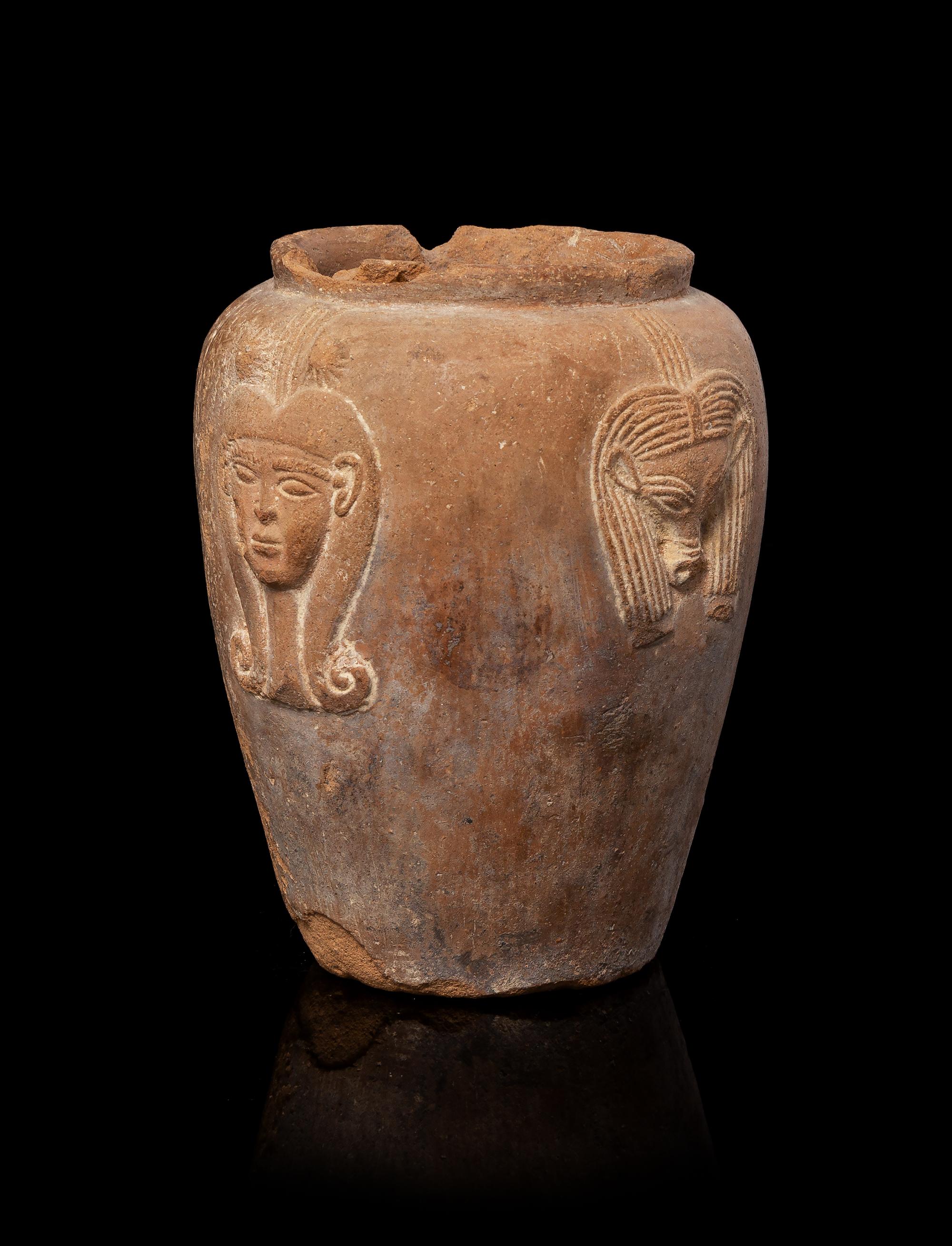 An Egyptian Terra Cotta Jar with Hathor Height 4 1/4 inches. — NEW KINGDOM, DYNASTY 18-19, 1550-1196 B.C.E.