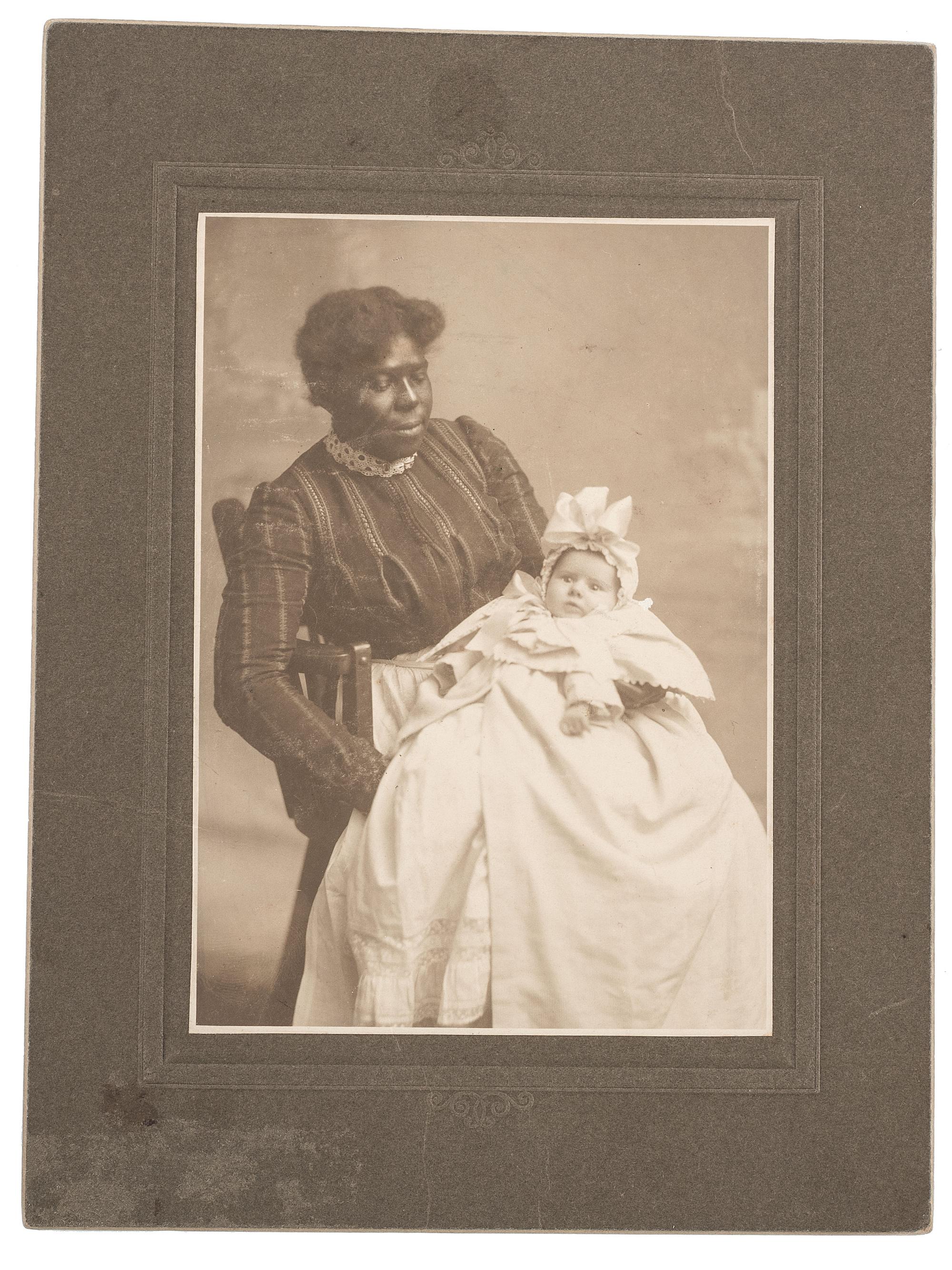 [EARLY PHOTOGRAPHY]. A pair of portraits of African American subjects holding white babies.