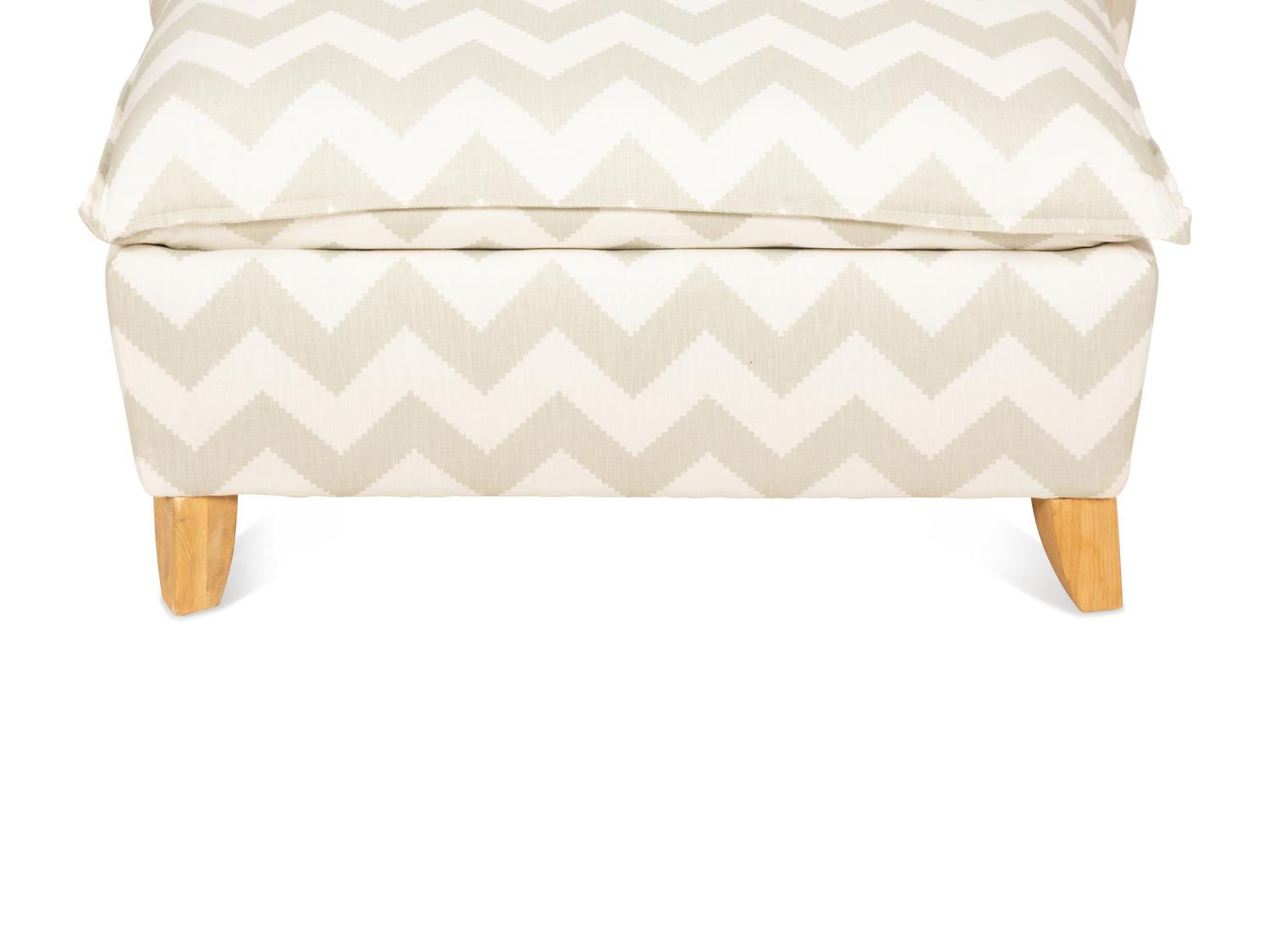 A Contemporary Upholstered Armchair and Ottoman