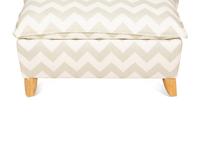 A Contemporary Upholstered Armchair and Ottoman