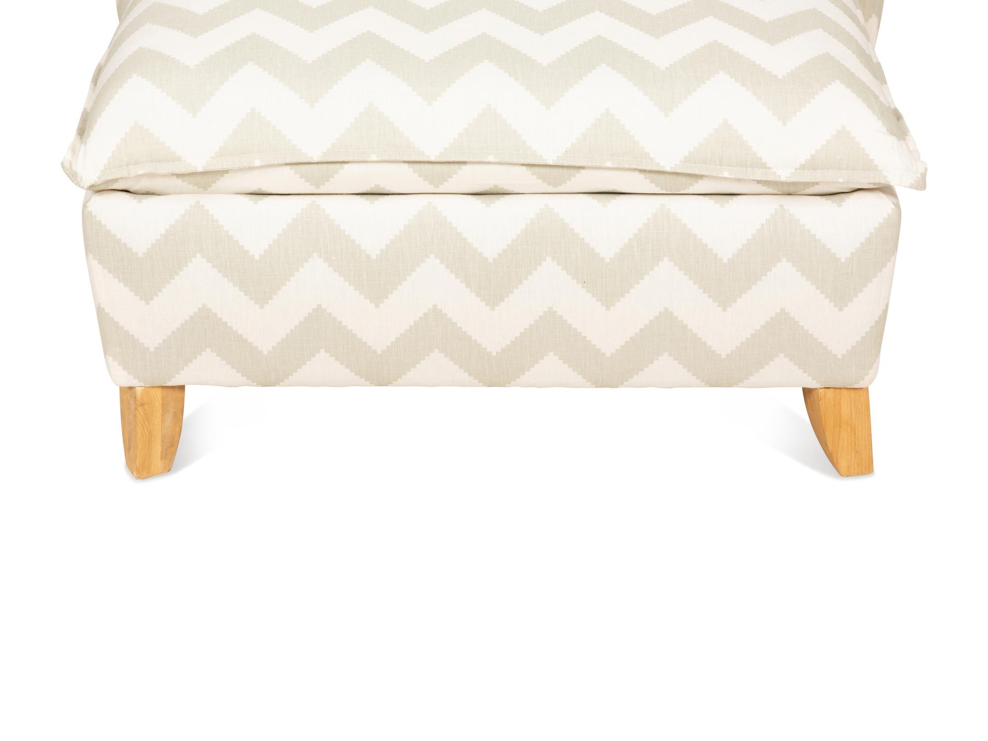 A Contemporary Upholstered Armchair and Ottoman
