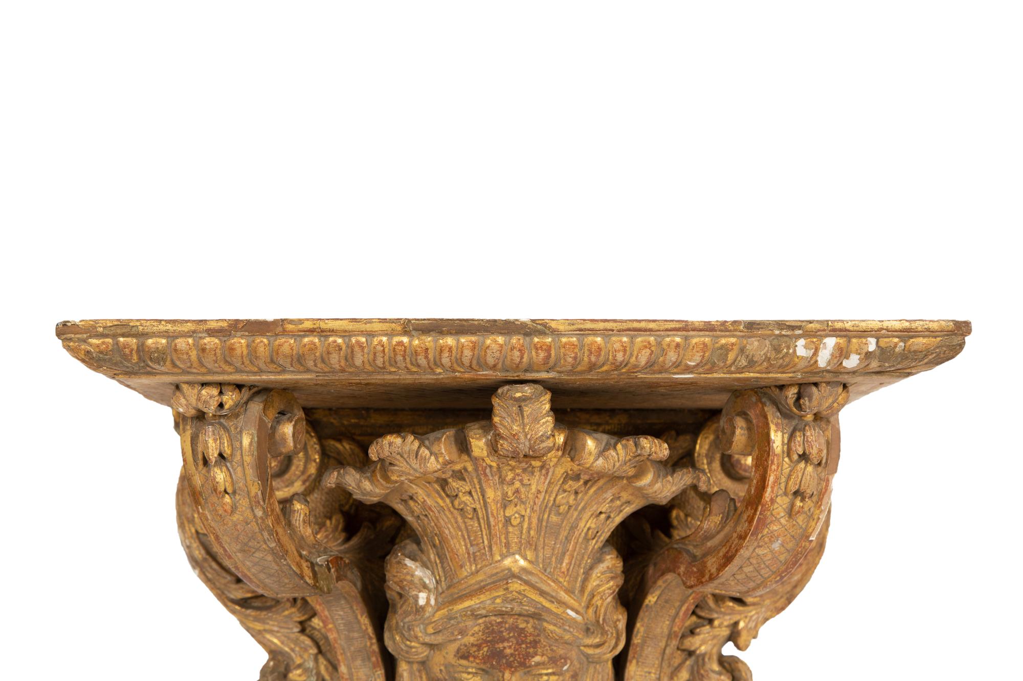 A Pair of Tin-Glazed Earthenware Wall Brackets, and Two Giltwood Wall Brackets