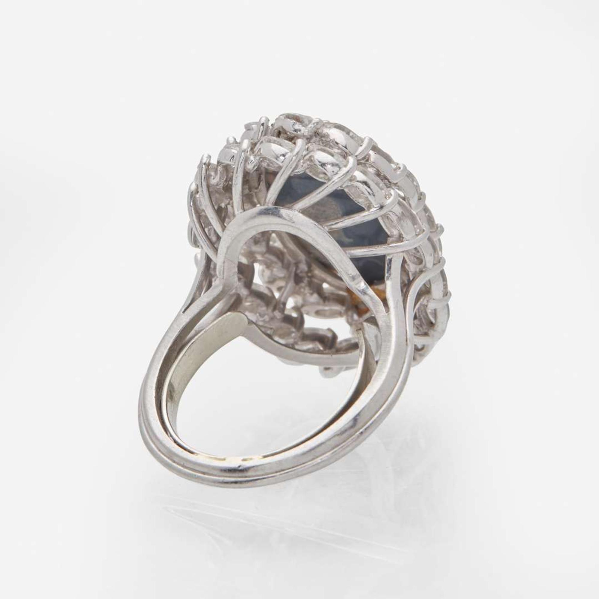 A Platinum, Black Opal, and Diamond Ring