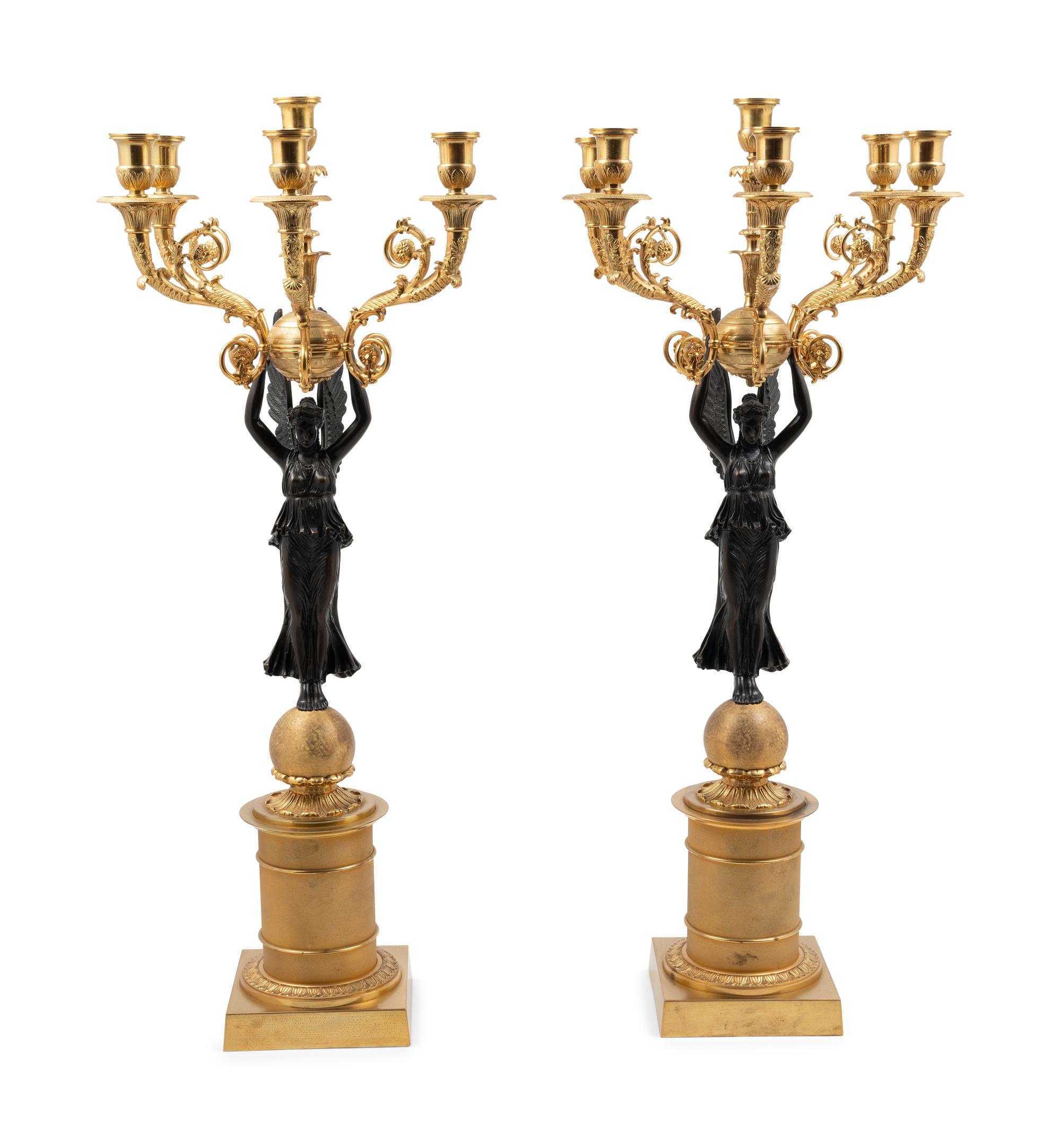 A Pair of Empire Style Gilt and Patinated Metal Six-Light Figural Candelabra