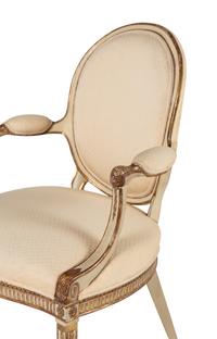 A Pair of Louis XVI Style Crème-Painted and Parcel Gilt Fauteuils