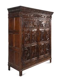 A Continental Carved Oak Wardrobe Cabinet