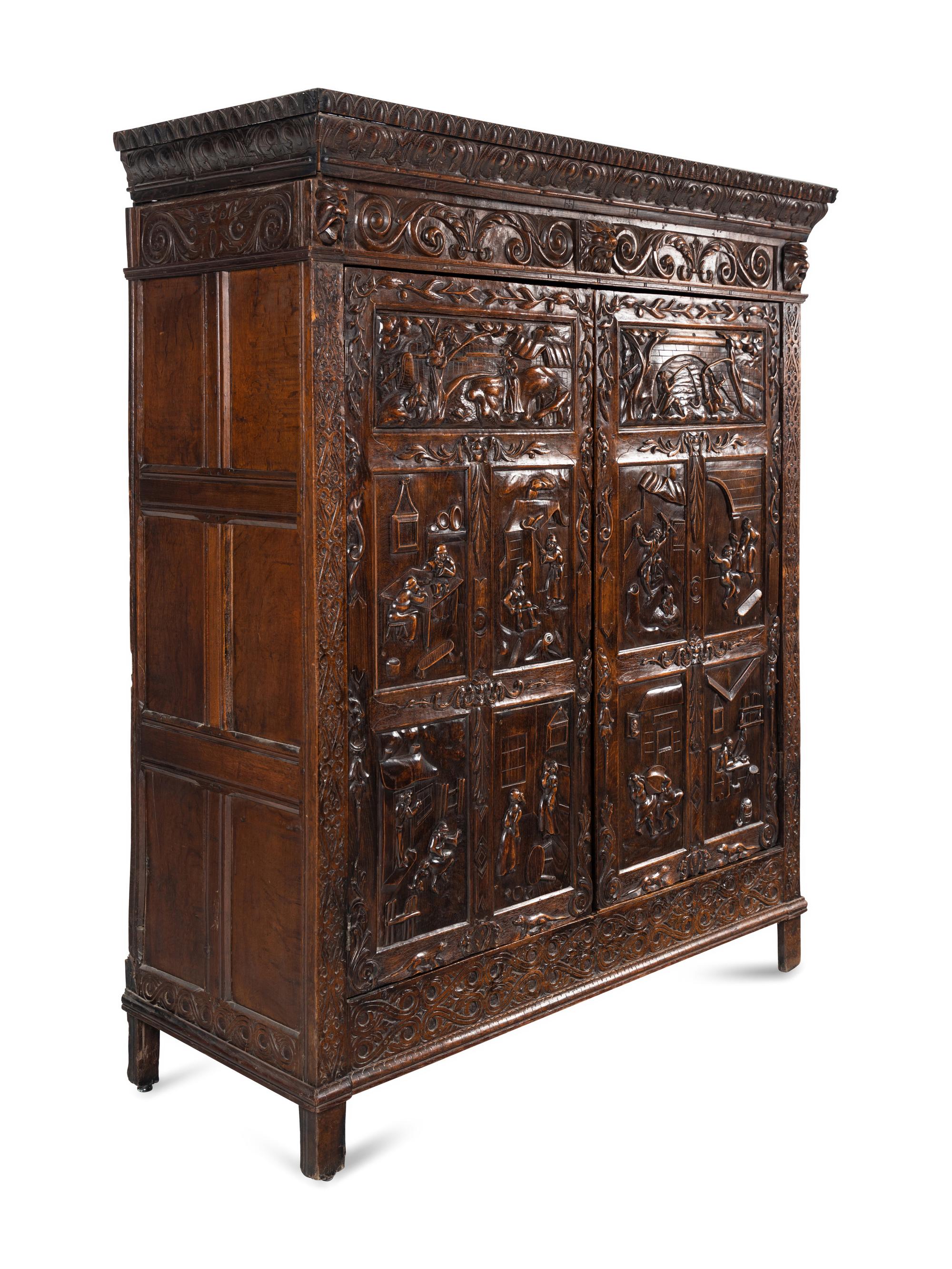 A Continental Carved Oak Wardrobe Cabinet