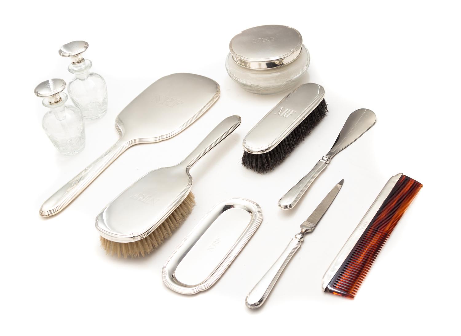 An American Silver Ten-Piece Dresser Set, Blackington & Co., North Attleboro, MA, First half 20th century, comprising a hand mirror, a