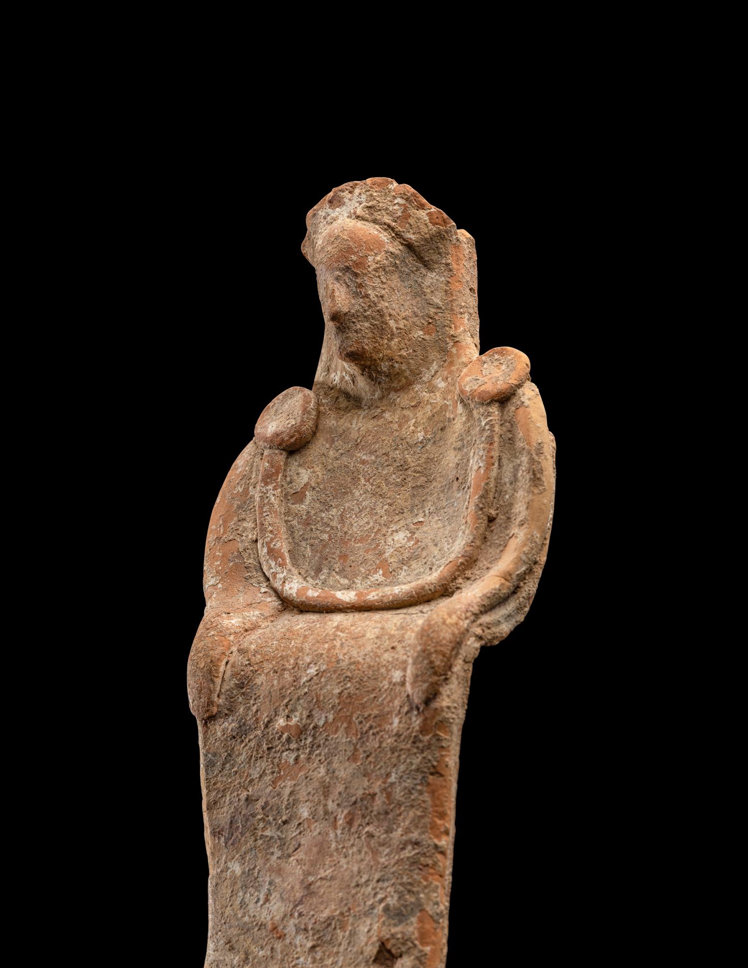 A Greek Terracotta Enthroned Goddess
