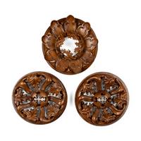 A Pair of Carved Oak Roundels