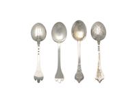 Two Cased Sets of Six George V Britannia Silver Trefid Teaspoons