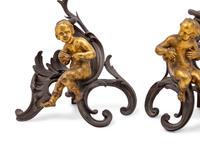 A Pair of Italian Rococo Gilt and Patinated Bronze Figural Chenets