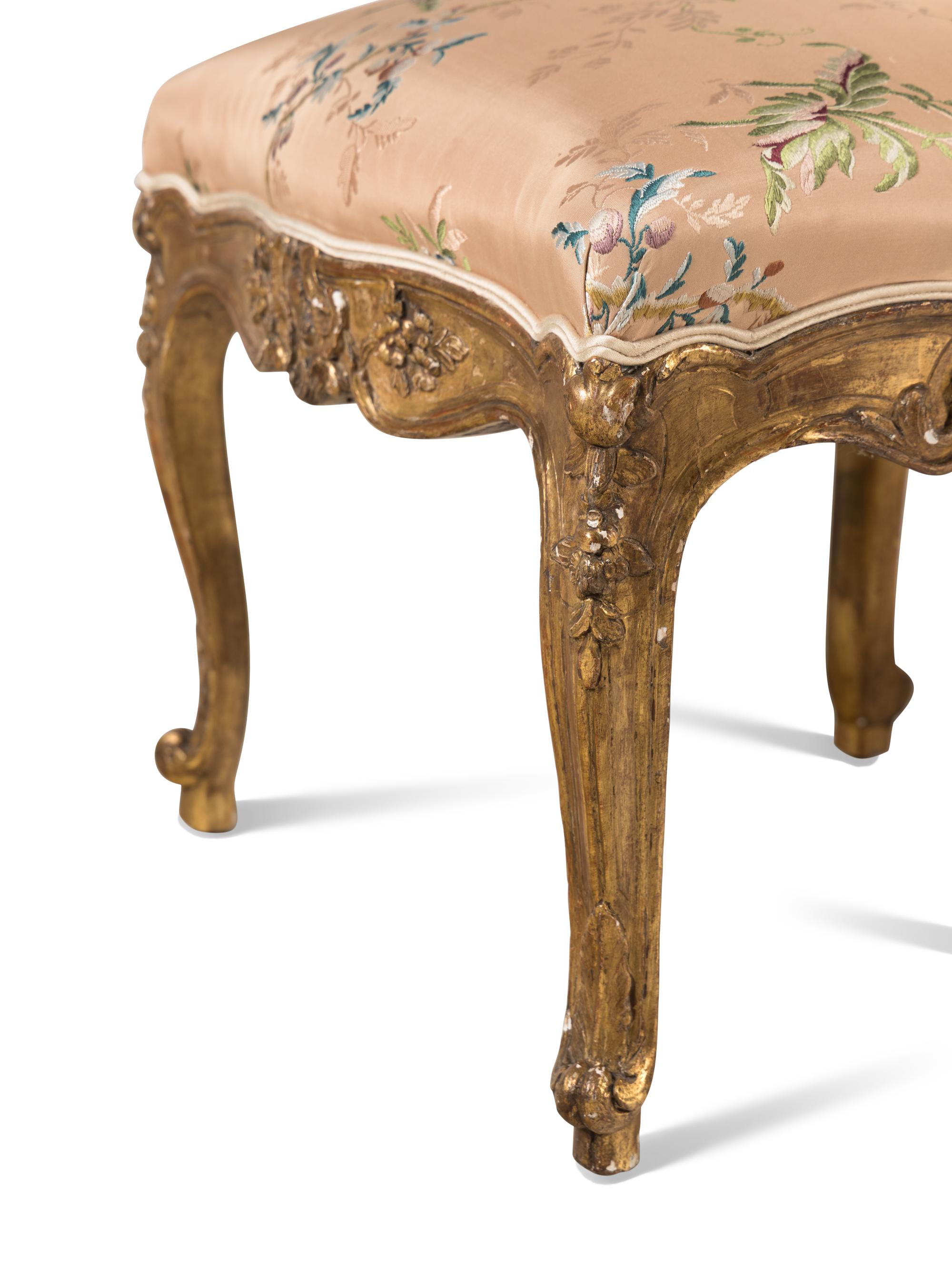 A Set of Ten Régence Style Giltwood Dining Chairs