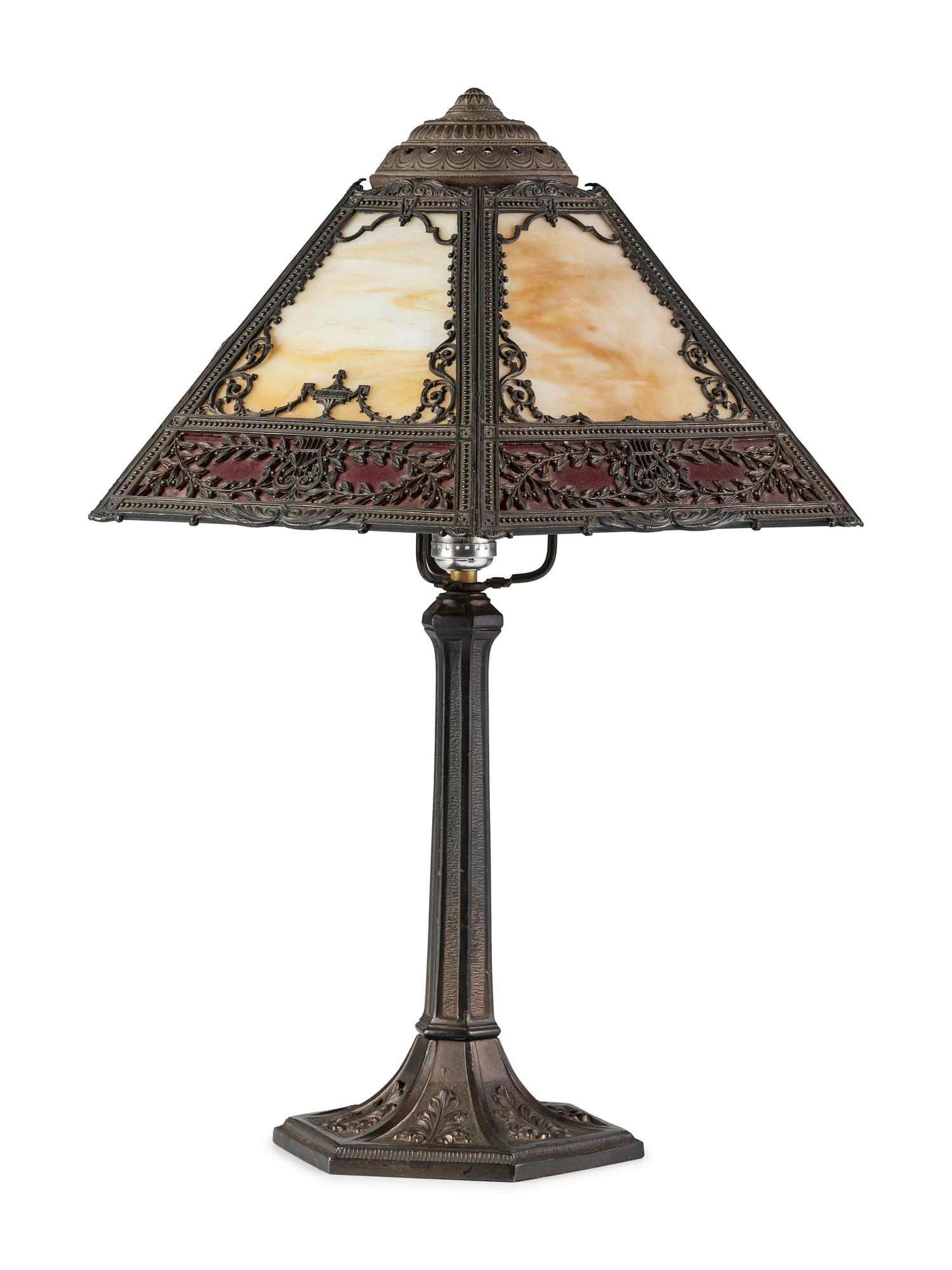 A Cast Iron and Slag Glass Table Lamp