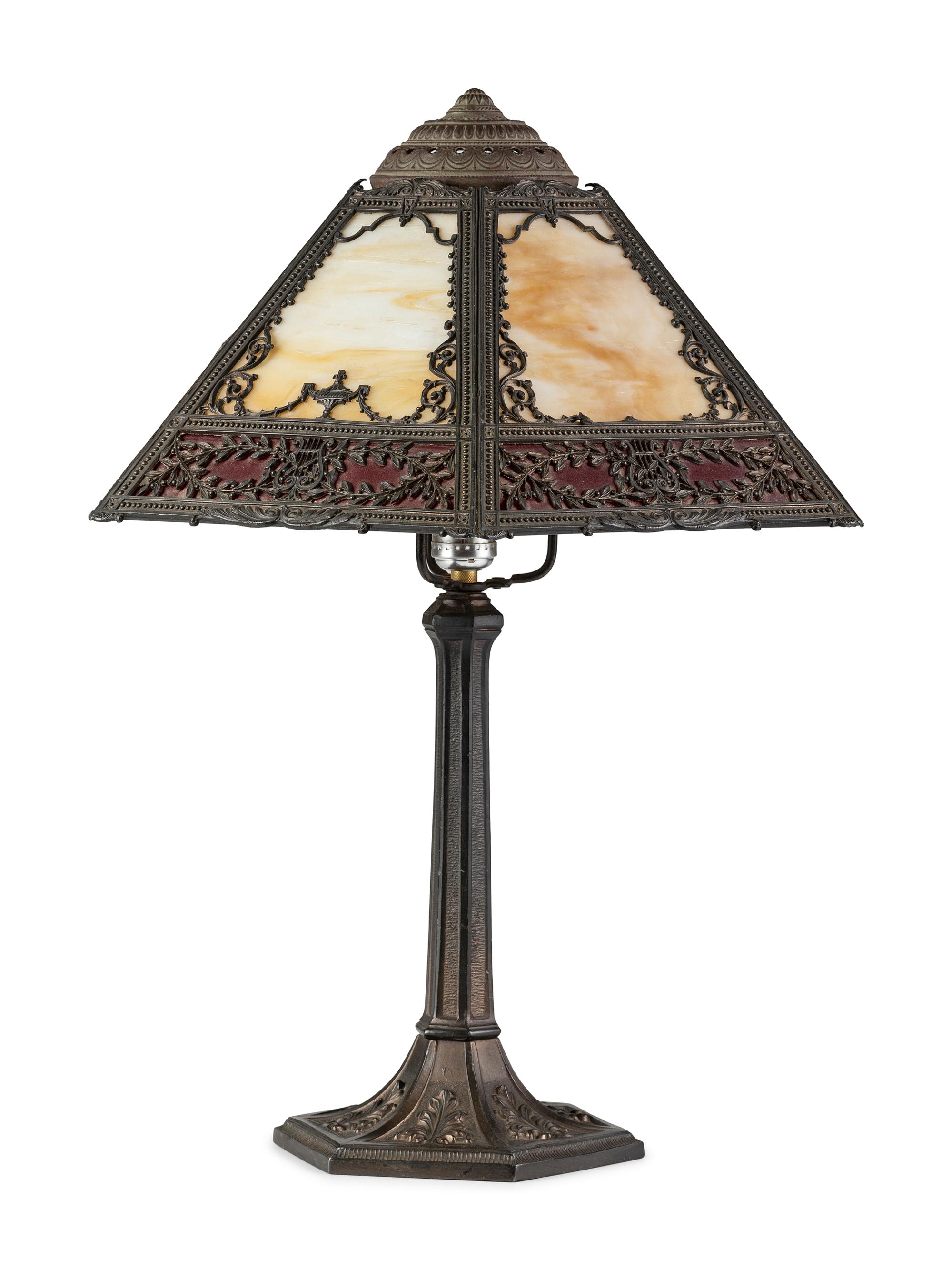 A Cast Iron and Slag Glass Table Lamp