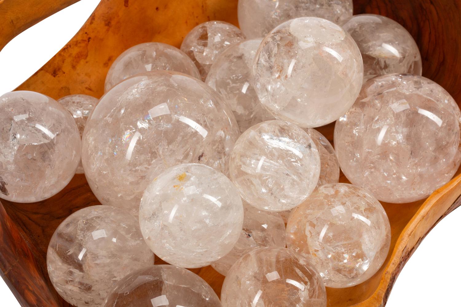 A Continental Carved Wood Basket with Eighteen Rock Crystal Spheres