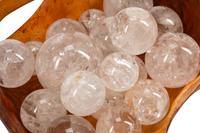 A Continental Carved Wood Basket with Eighteen Rock Crystal Spheres