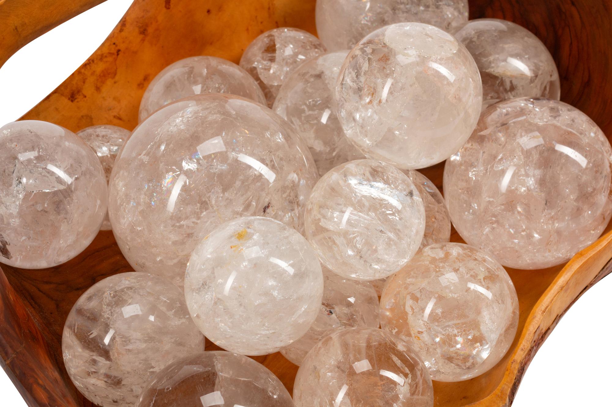 A Continental Carved Wood Basket with Eighteen Rock Crystal Spheres