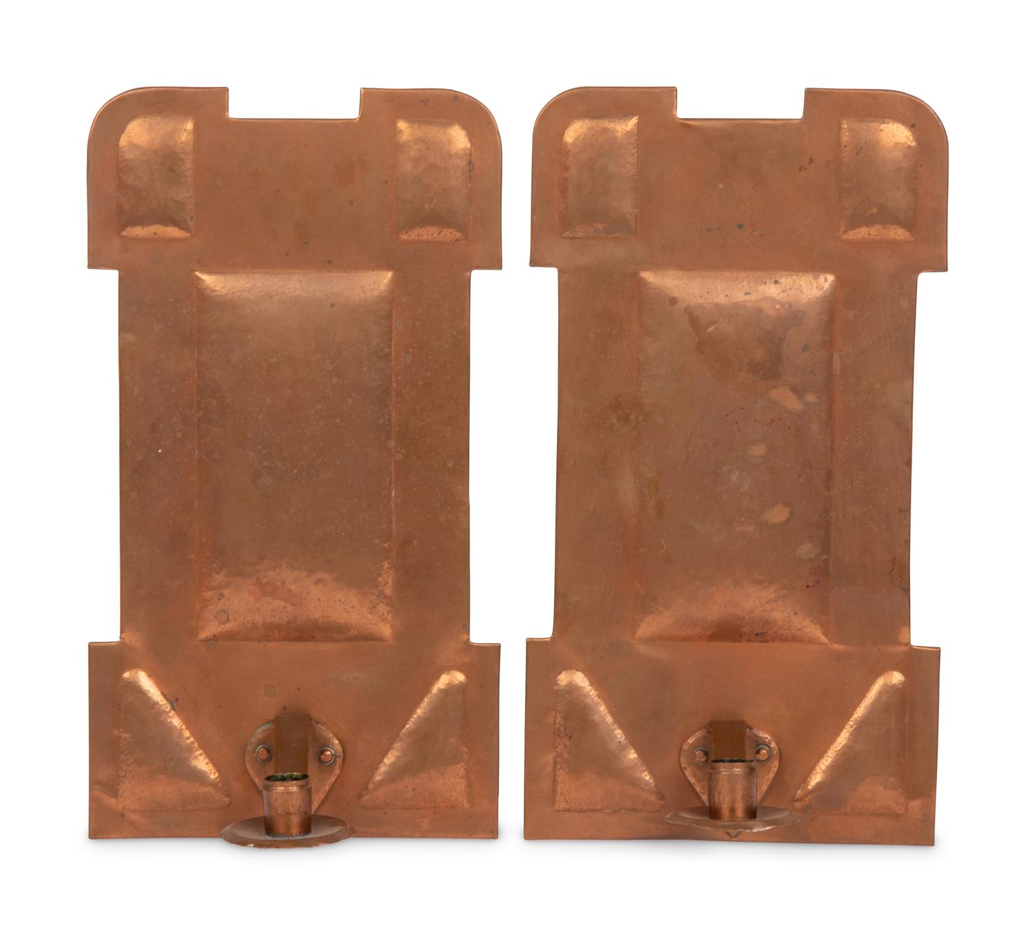 A Pair of Arts and Crafts Hammered Copper Sconces