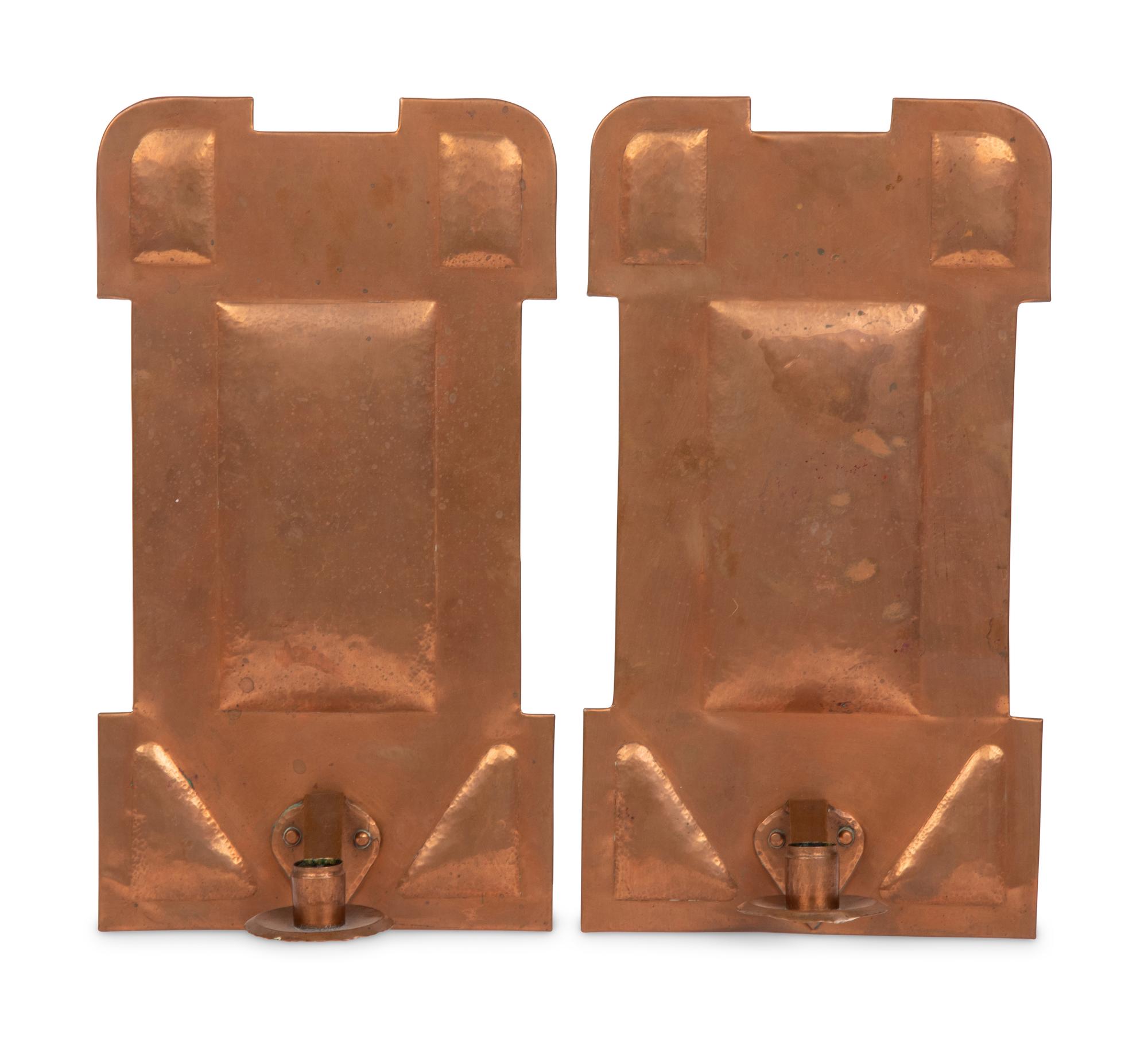 A Pair of Arts and Crafts Hammered Copper Sconces