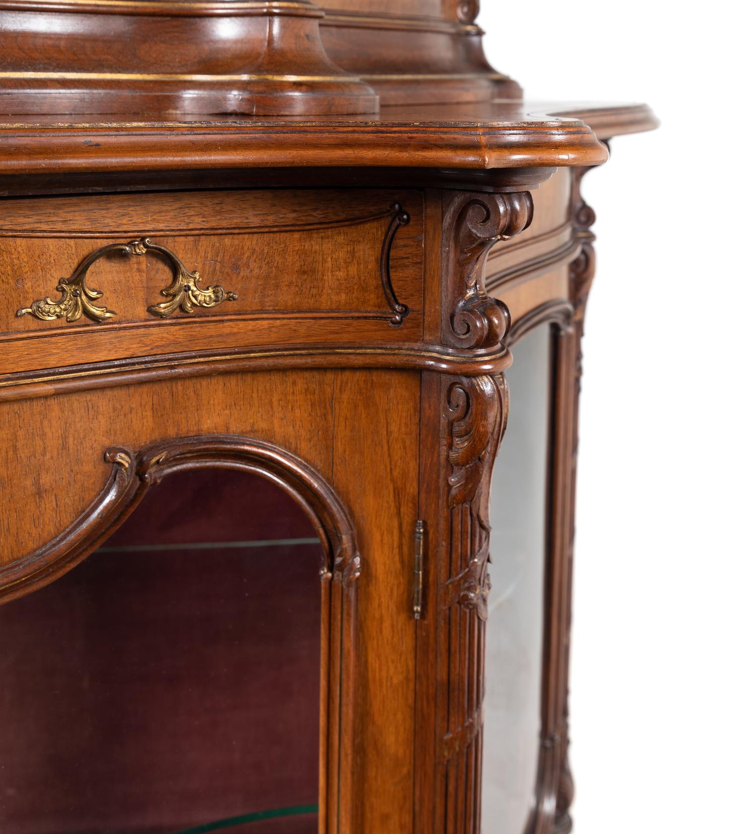 A Rococo Revival Carved Walnut Corner Vitrine Cabinet