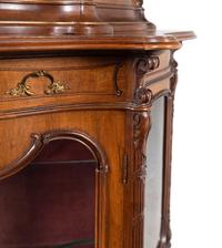 A Rococo Revival Carved Walnut Corner Vitrine Cabinet
