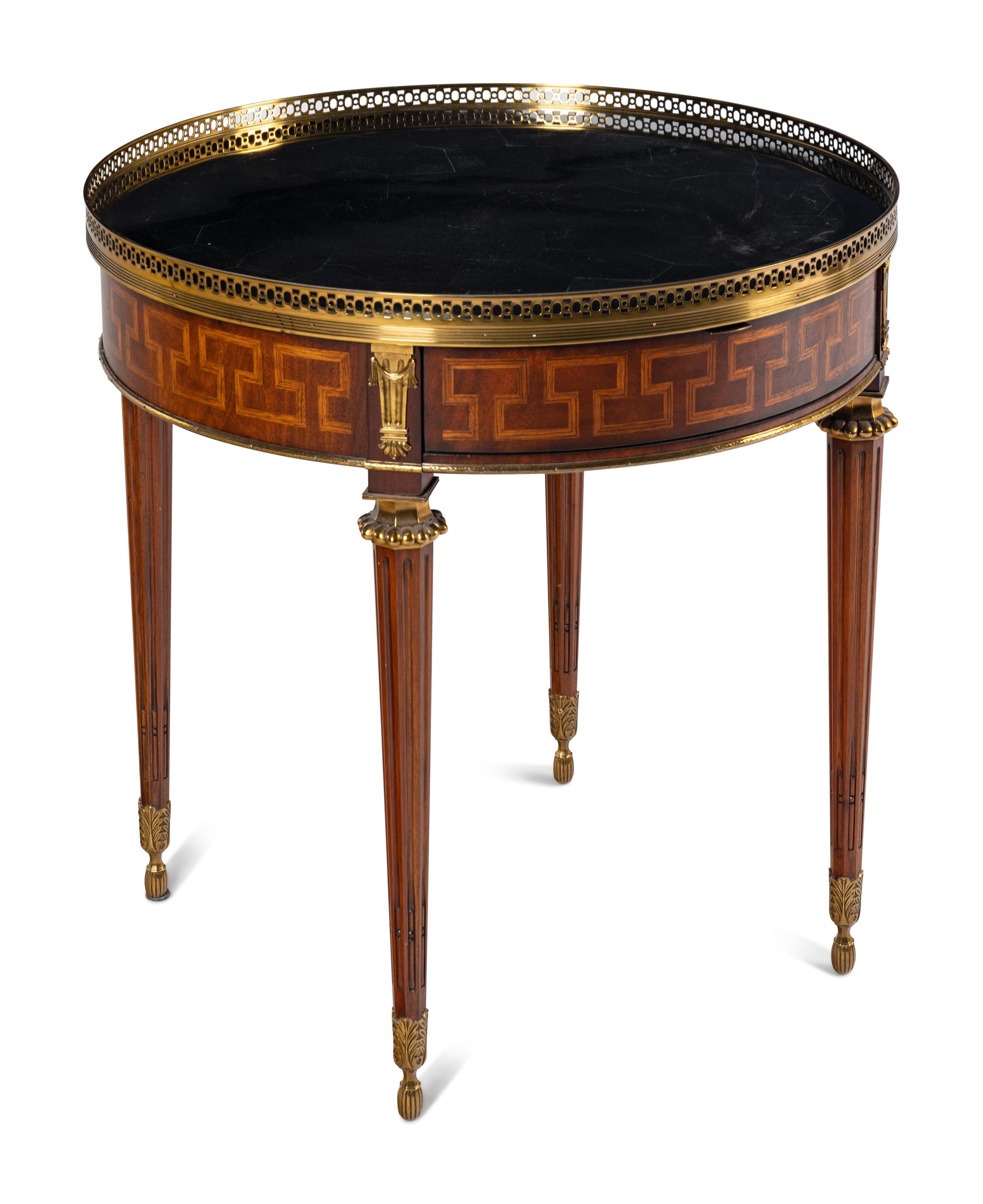 A Louis XVI Style Gilt Metal Mounted Marble-Top Mahogany Guéridon