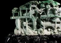 A Large Carved Apple Green and Celadon Jadeite Mountain
