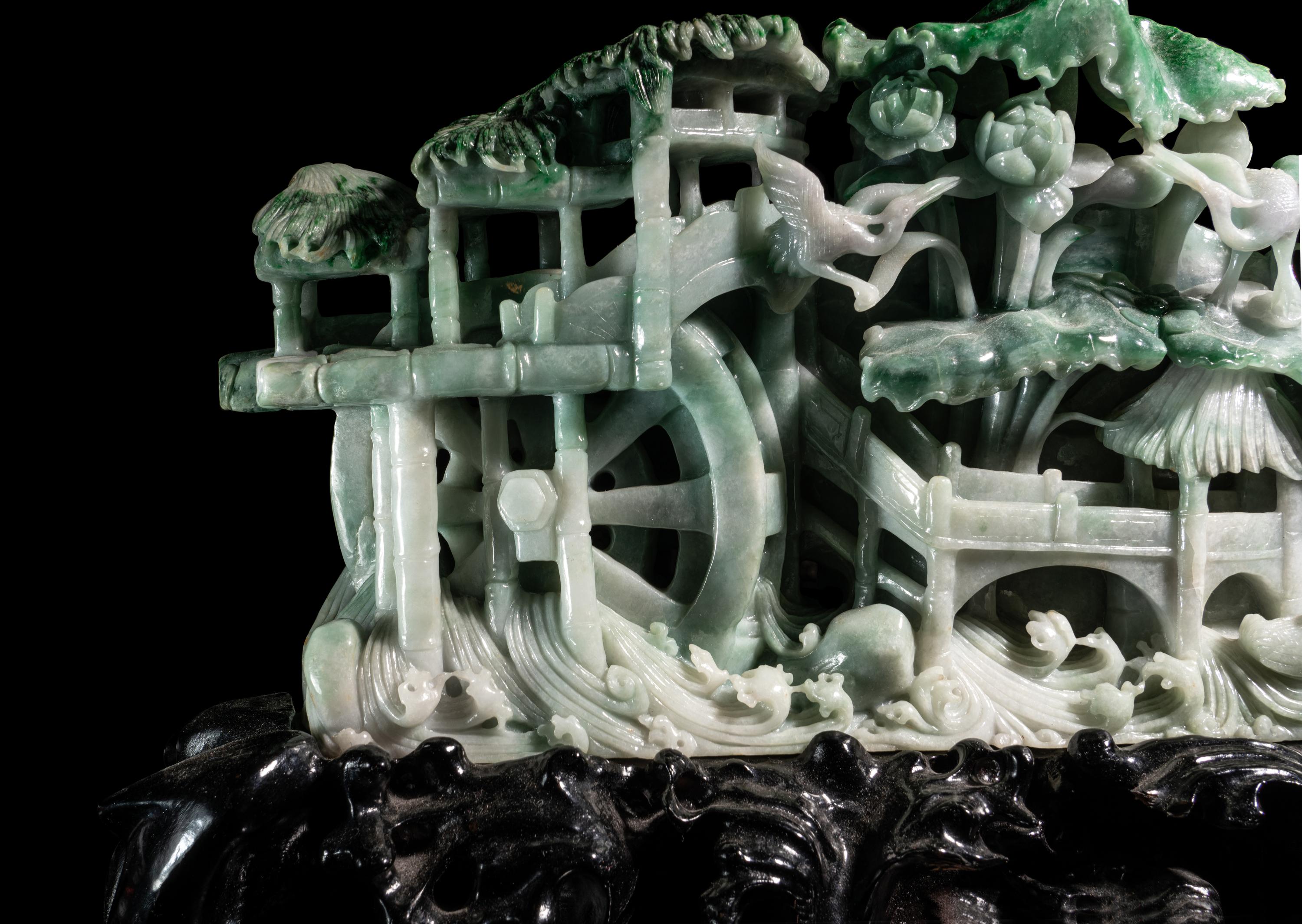 A Large Carved Apple Green and Celadon Jadeite Mountain