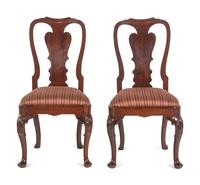 A Pair of Queen Anne Shell-Carved Walnut Pad Foot and Compass Seat Side Chairs