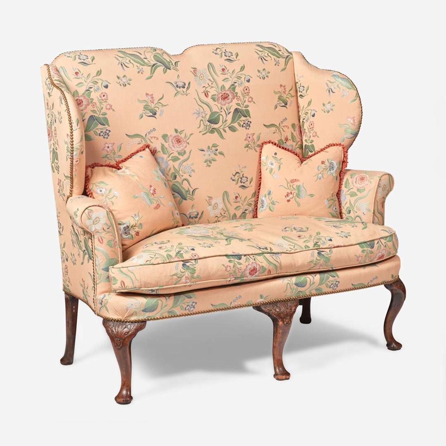 A George I carved walnut settee early 18th century