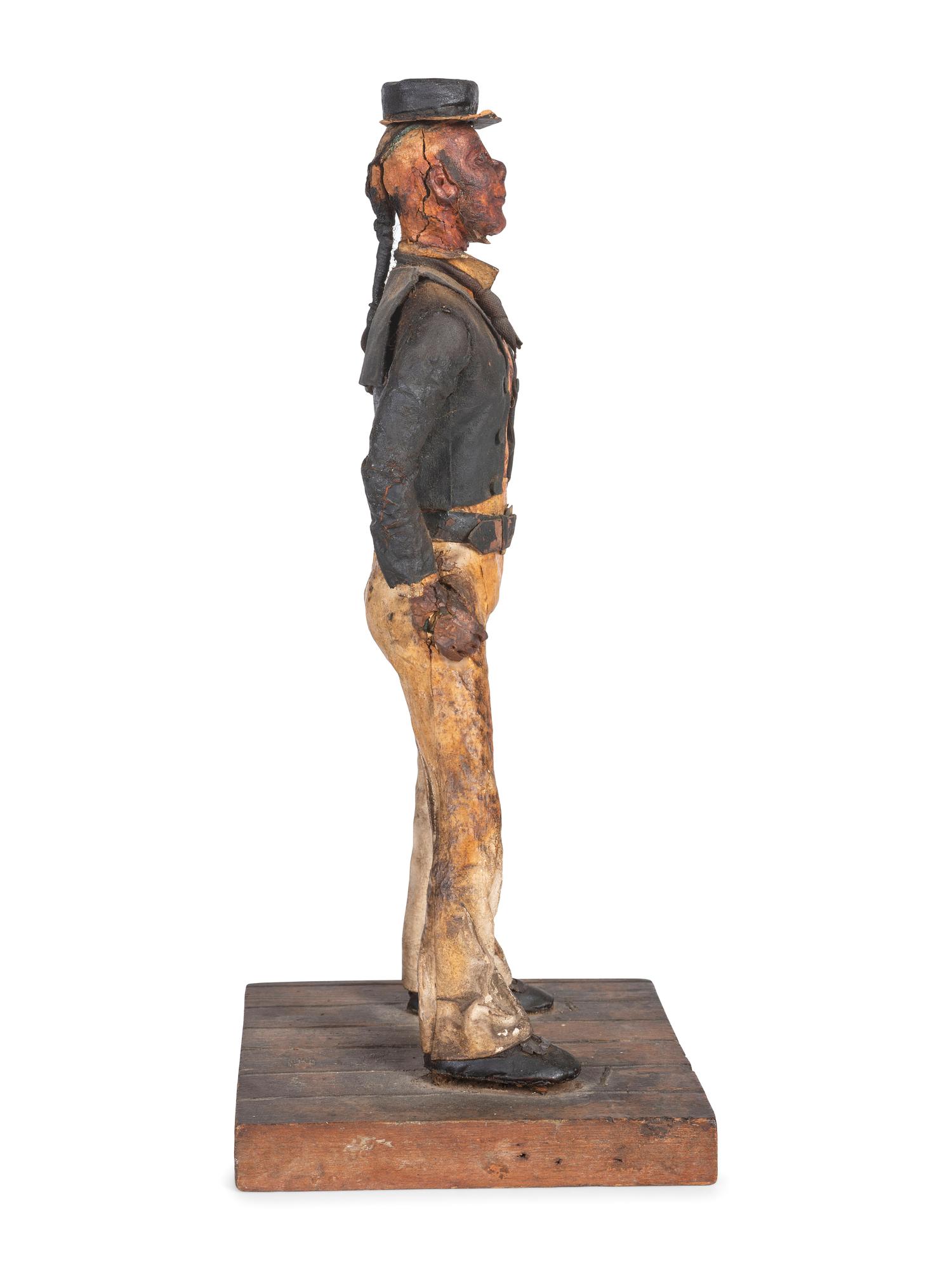 A Carved Wood and Papier-Mache Figure of a Sailor