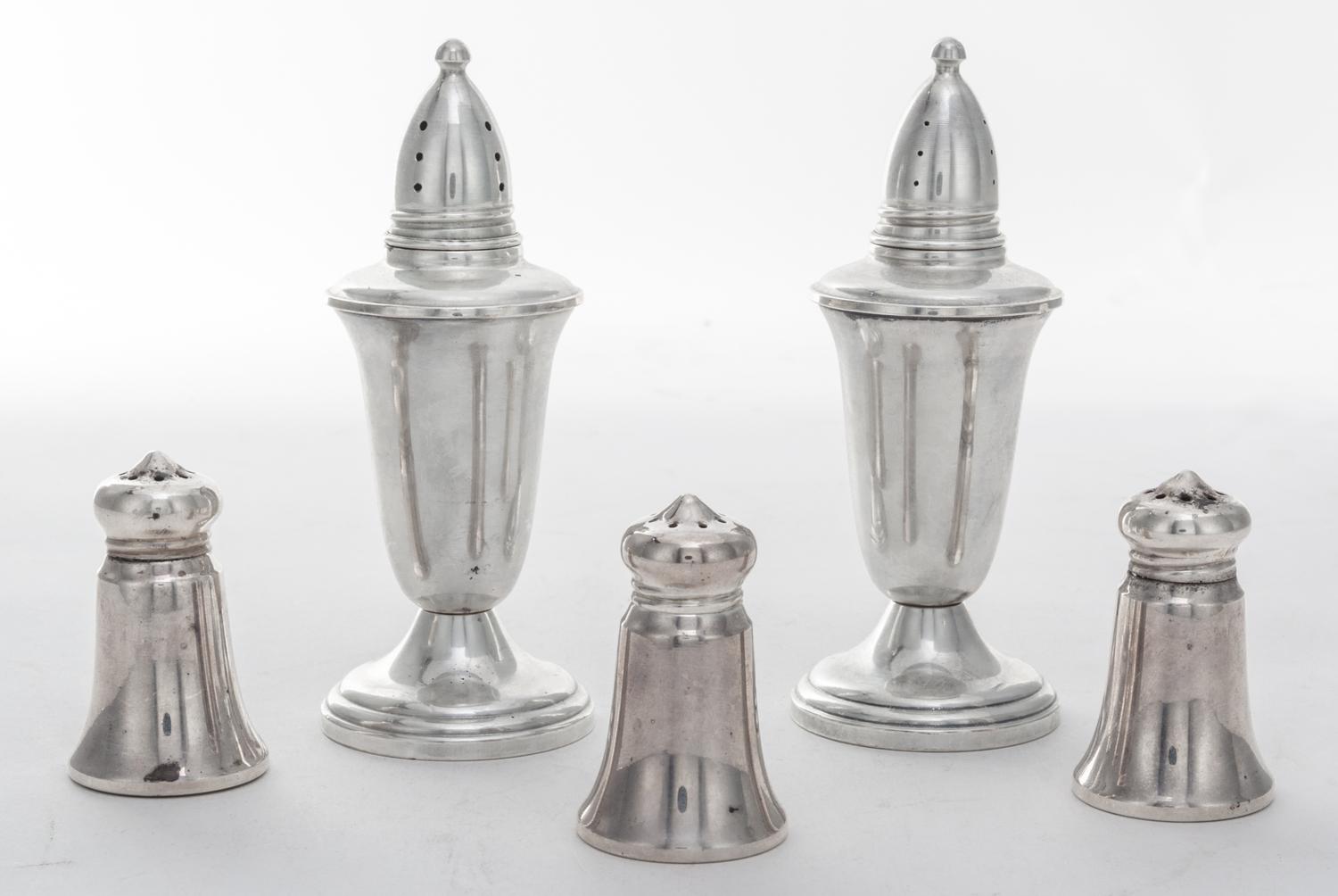 A Group of Five American Silver Casters, various makers, comprising a weighted pair and three smaller examples.