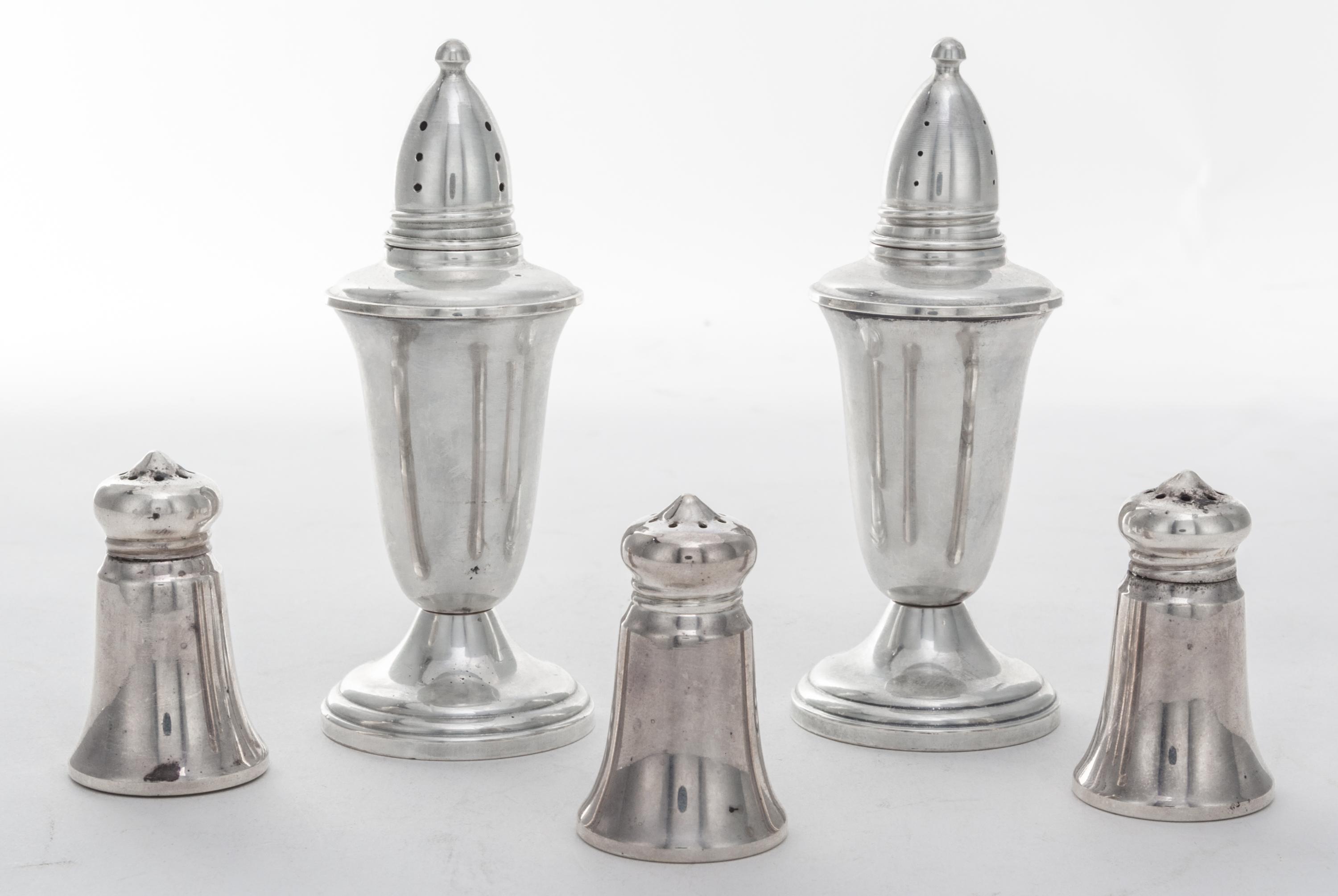 A Group of Five American Silver Casters, various makers, comprising a weighted pair and three smaller examples.