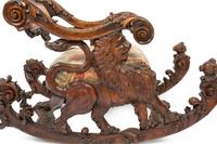 An Italian Carved Walnut Fantasy Rocking Chair