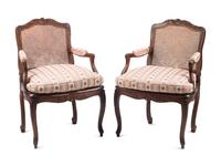 A Pair of Louis XV Provincial Walnut Caned Fauteuils