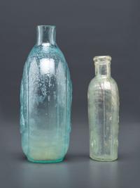 A Washington-Taylor Portrait Flask and South Carolina Dispensary Flask