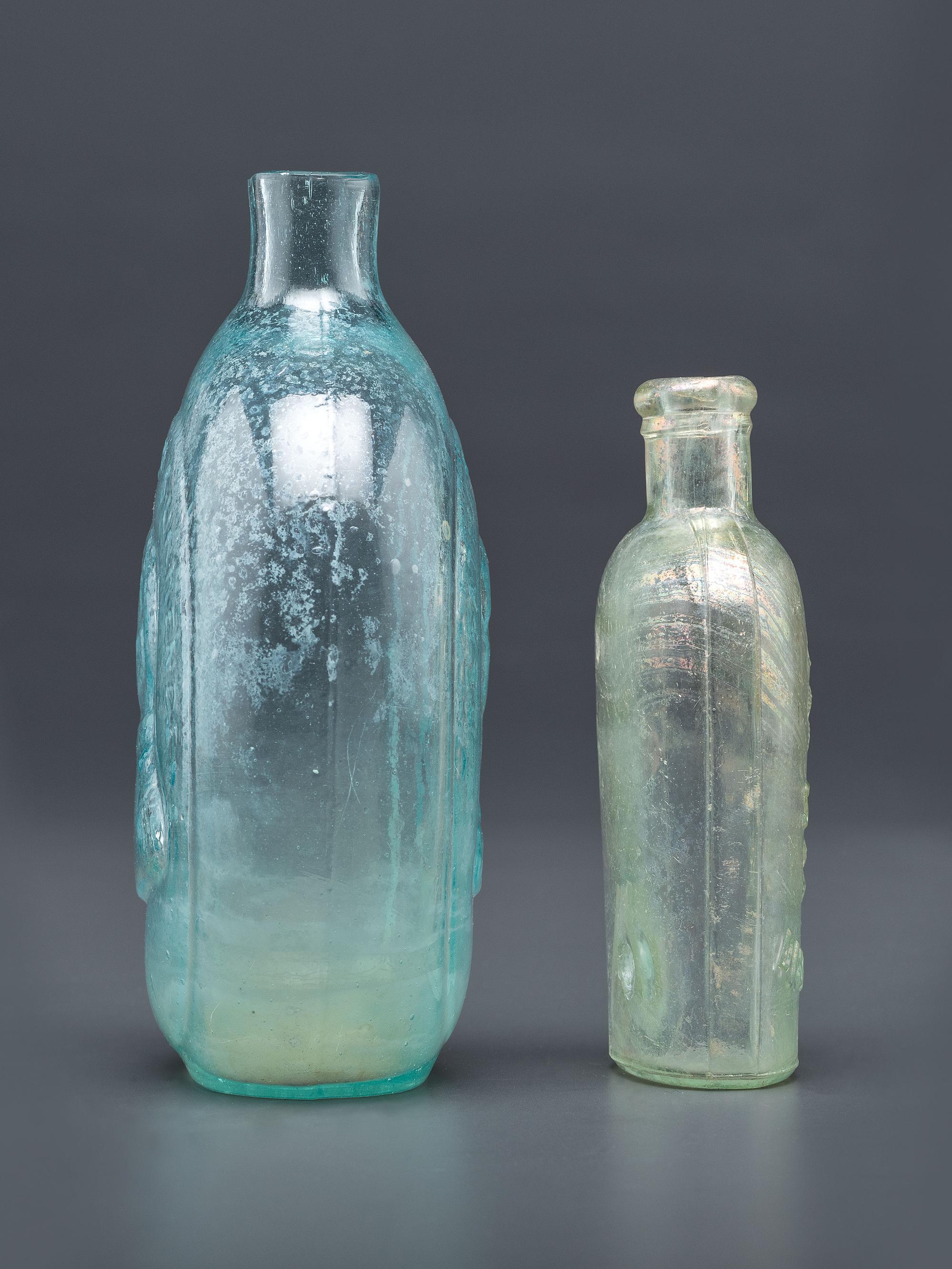 A Washington-Taylor Portrait Flask and South Carolina Dispensary Flask