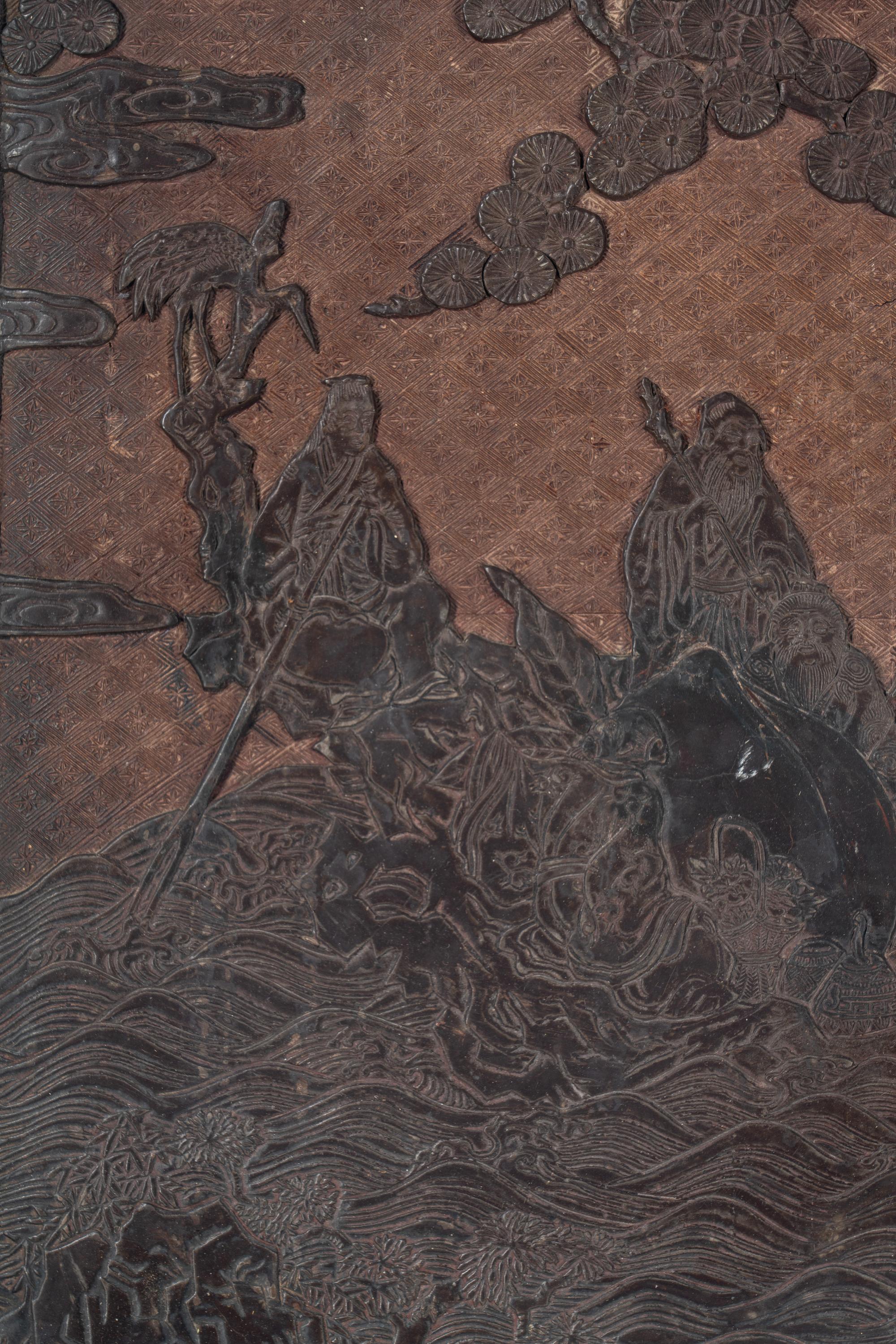 A Chinese Carved Lacquer 'Immortals' Wall Panel